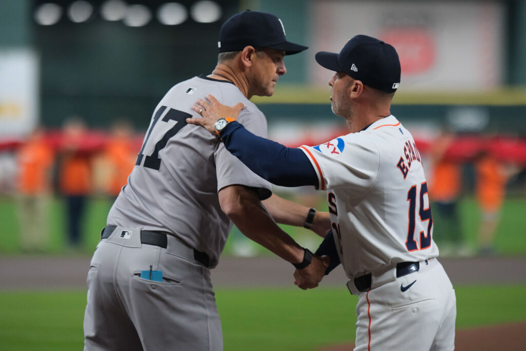 New York Yankees manager Aaron Boone and Astros manager Joe Espada both know something about pressure. (Photo by F. Carter Smith)
