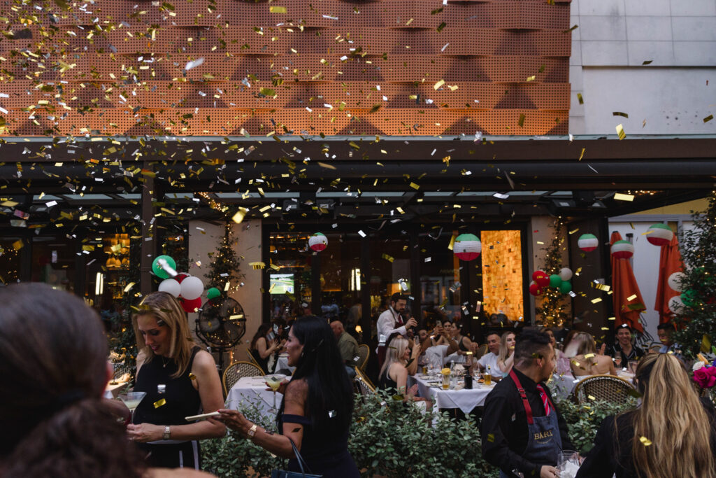 Gold-infused confetti showers guests during the pistachio cake-cutting during Bari's one-year anniversary celebration. (Photo by Johnny Than )