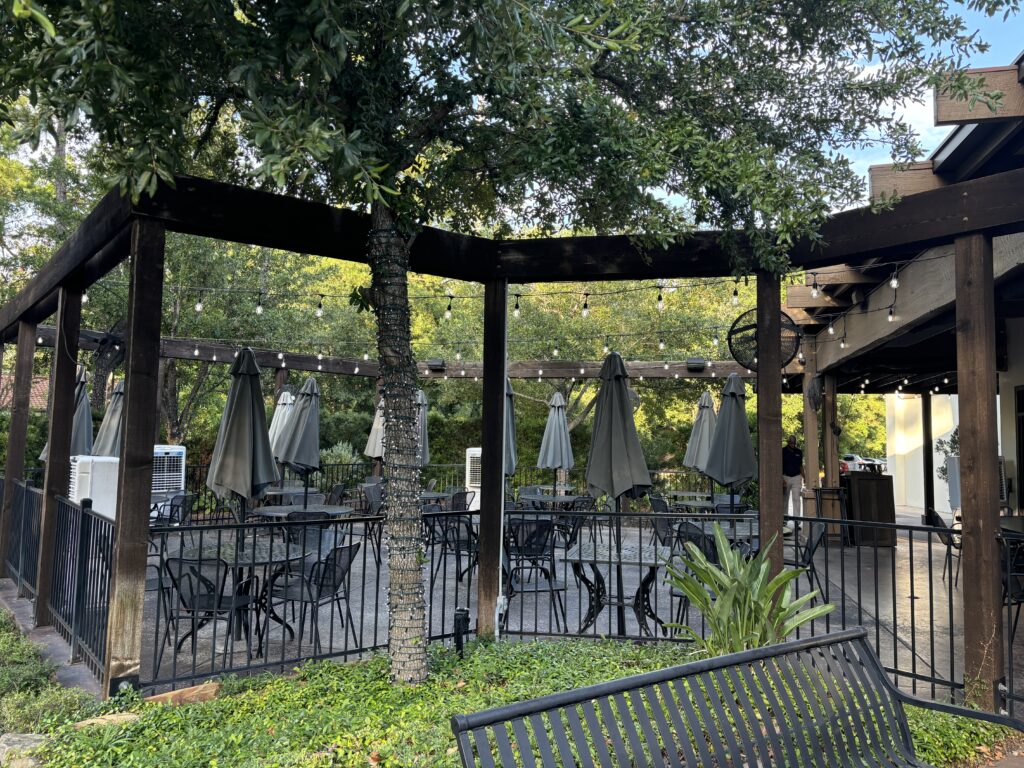 The patio at Republic Grill boasts trees that McBurney planted 10 years ago on the property provide shade. Heat lamps keep the patio toasty in cooler months. (Photo by Laura Landsbaum)