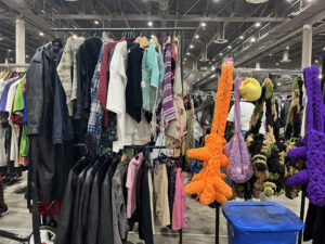 Crocheted purses and other crafted wares hang on a rack (Photo by Jenna Baer)