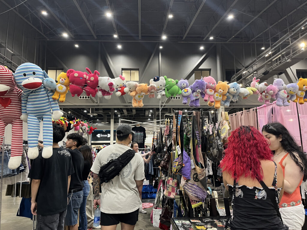 Eager thrifting treasure hunters comb through racks of clothes at ThriftCon Houston (Photo by Jenna Baer)