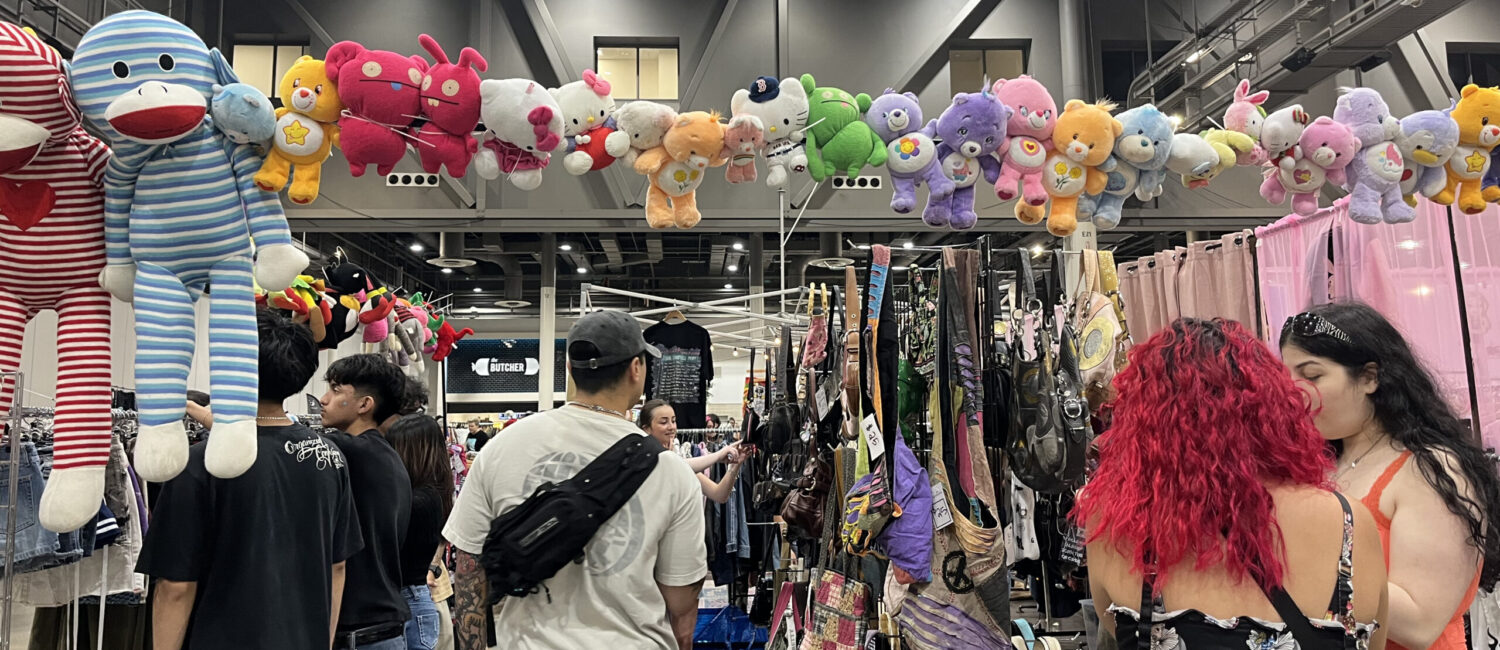 Eager thrifting treasure hunters comb through racks of clothes at ThriftCon Houston (Photo by Jenna Baer)