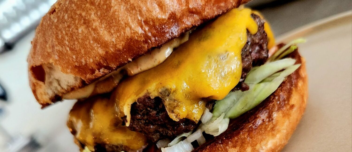 The Burger on the Belly of the Beast lunch menu features the restaurant's secret sauce and "burger de gallo. (Photo by Thuy An)
