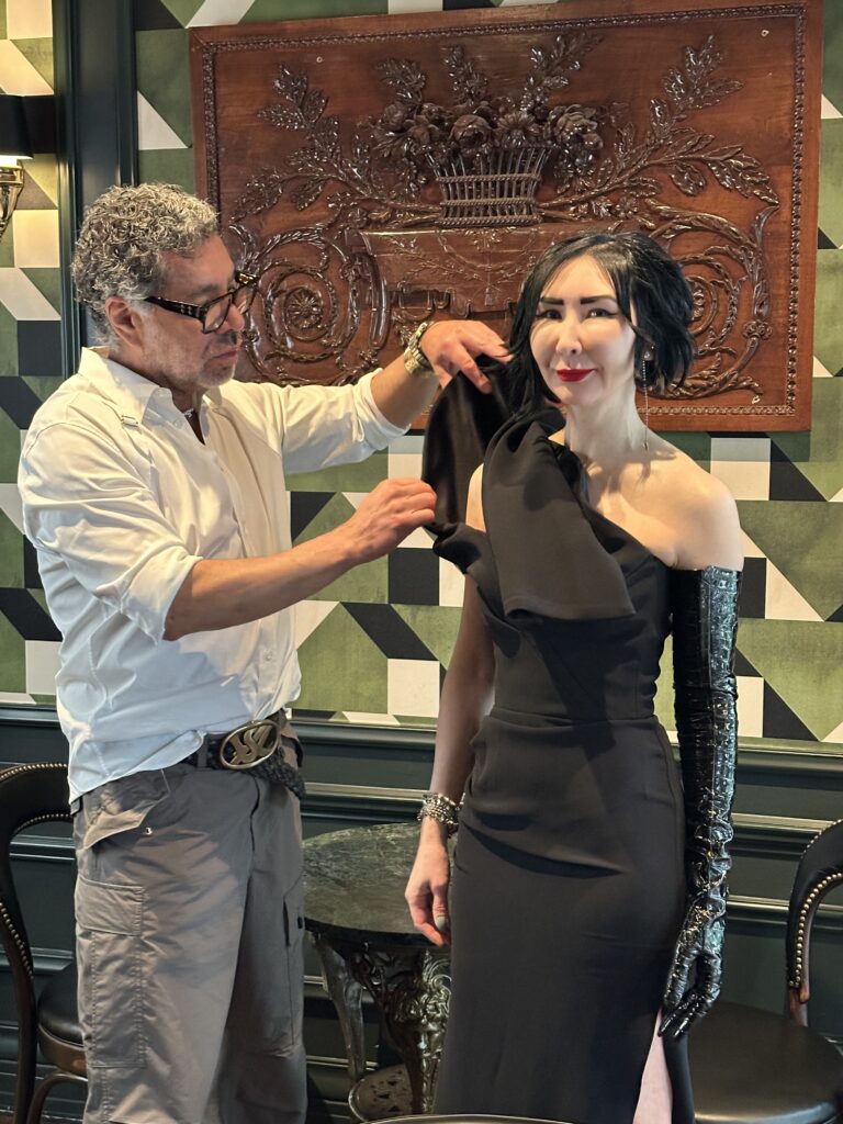 Ceron assists Carrie Brandsberg-Dahl wearing Maticevski and a St. Laurent crocodile glove for the PaperCity Philanthropy in Fashion  Best Dressed photo shoot at La Colombe d'Or. (Photo by Shelby Hodge)