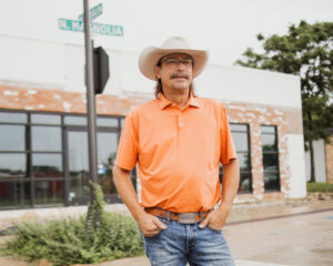 Quincy Wallace standing In front of the new Fred’s location in Crowley