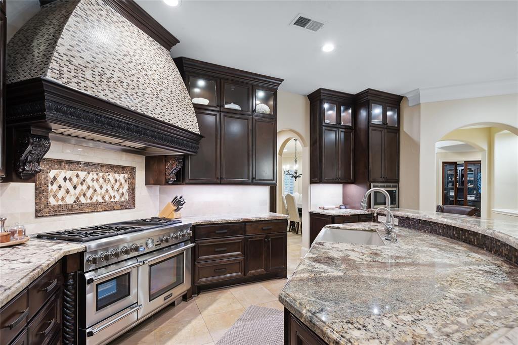 The spacious kitchen comes with professional grade appliances. 