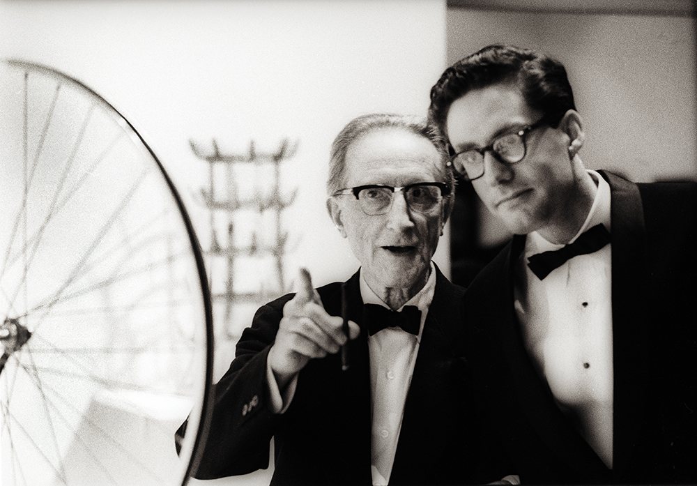 From Left: Marcel Duchamp and Walter Hopps. Artist Terrell James was friends with Hopps and his wife Caroline Huber for many years. (Photo: © 1963 Julian Wasser)