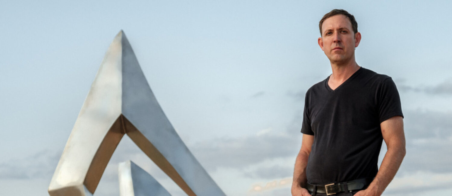 Artist Morgan Robinson (pictured here with his “Nestle” sculpture, has adopted Houston as his art base.