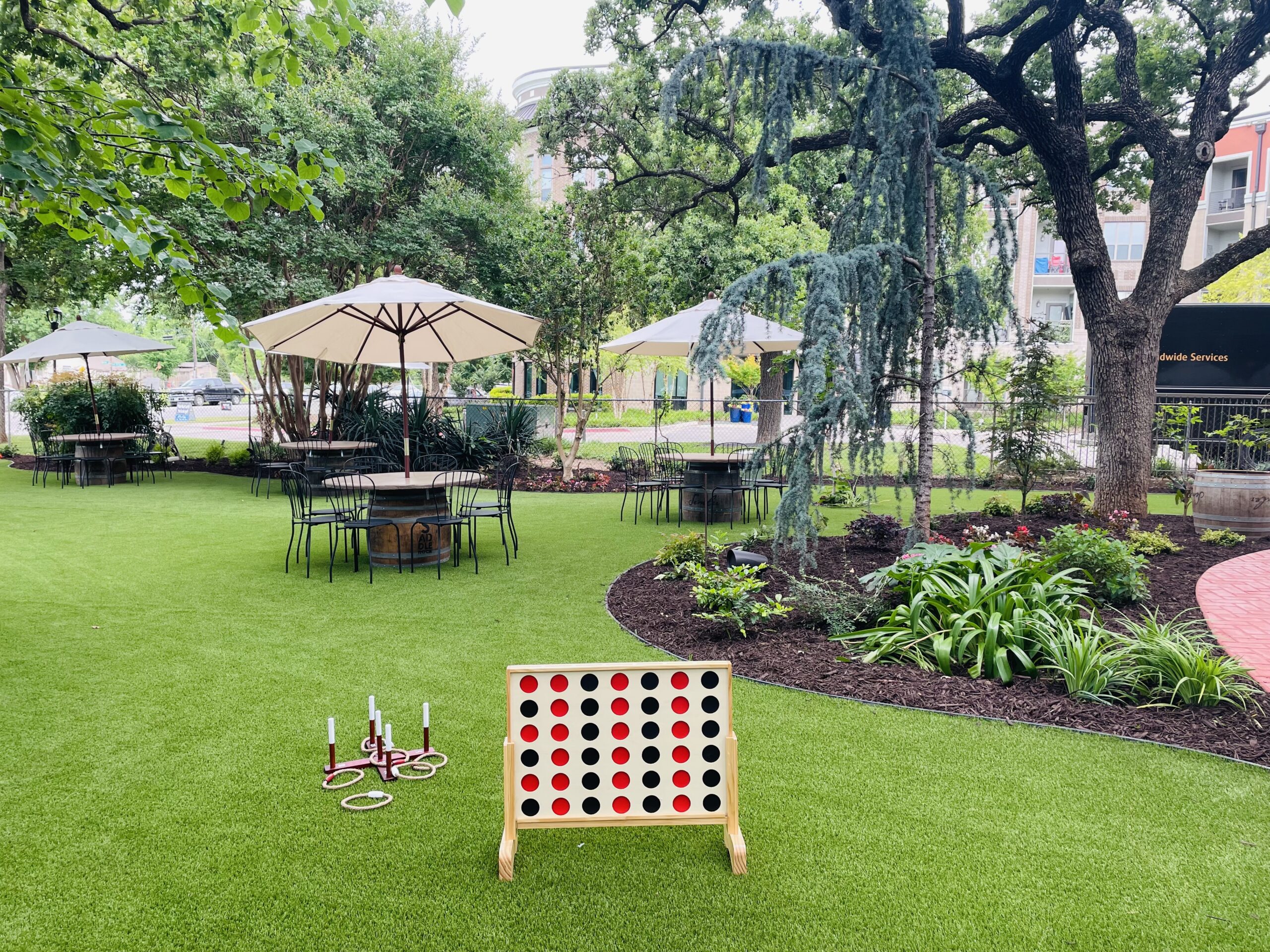 Saddlerock – The shady front lawn with seating and games at Saddlerock Wine + Beer Co. (Photo by Courtney Dabney)