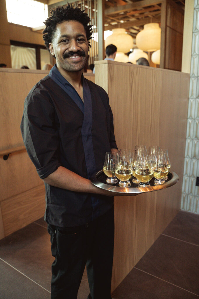 Sake flows throughout the evening at the opening of Azumi in River Oaks District. (Photo by Jonah Tijerina)