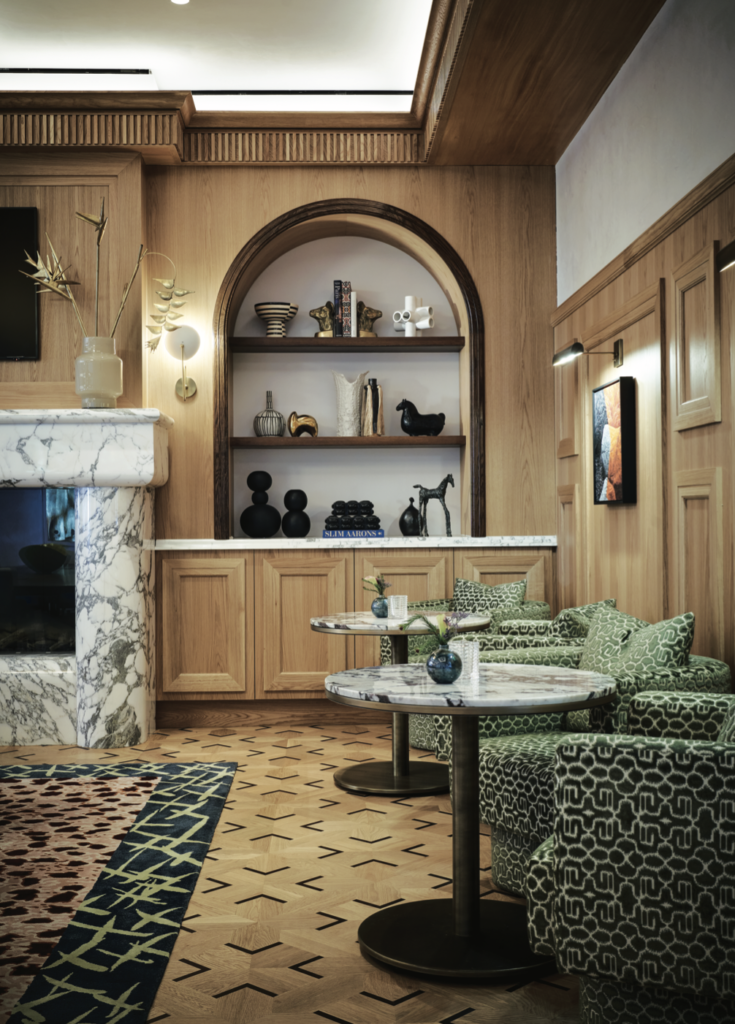 A cozy corner of The Living Room is the perfect spot for an aperitif next to the fireplace. (Photography by Pär Bengtsson) (Photo by Pär Bengtsson and Michelle Aviña)