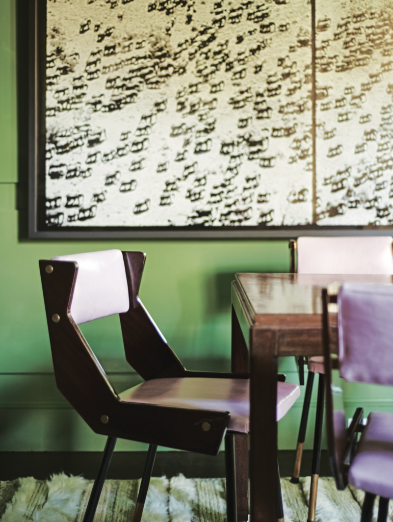Peter Beard artwork. Italian 1950s chairs from Jan Showers. Game table from Conjeaud & Chappey, New York. (Photo by Richard Powers)