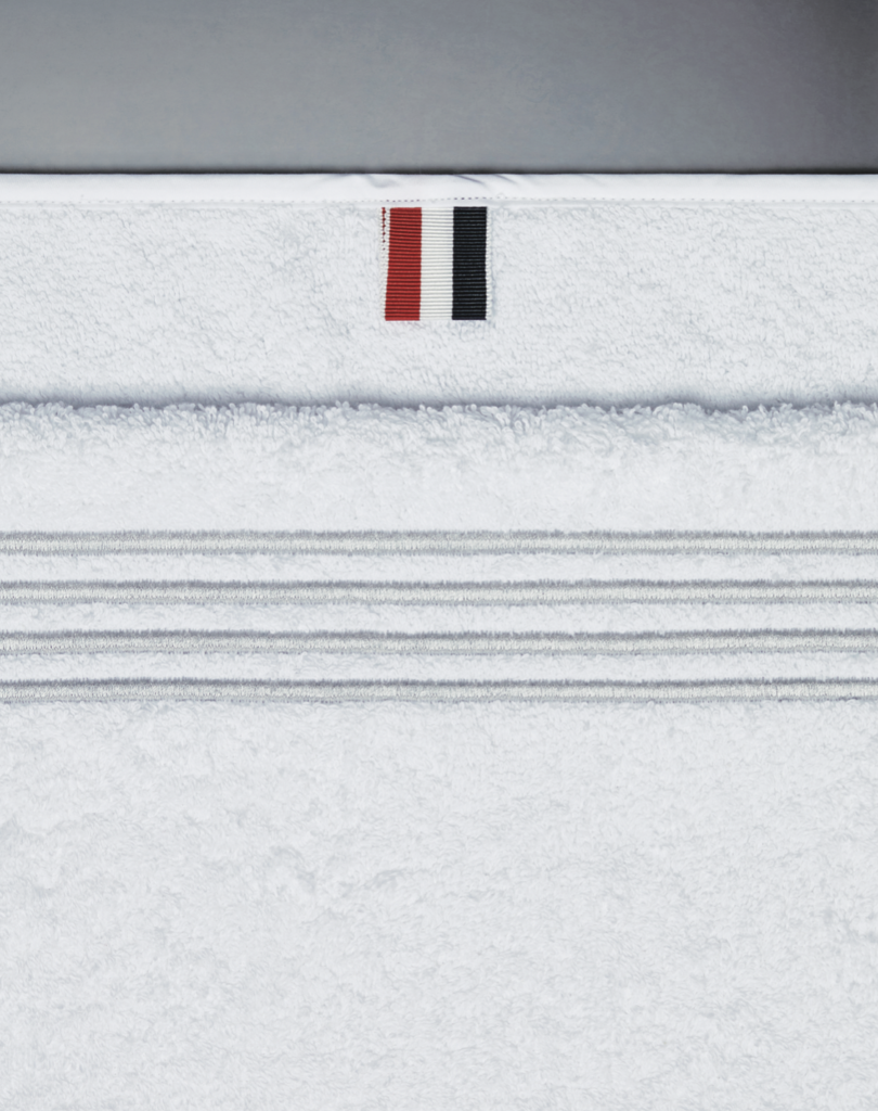 Gym towel with Thom Browne four-bar motif.