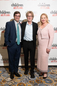 Children at Risk dinner chairs Wells & April McGee with headliner Dana Carvey (Photo by Daniel Ortiz)