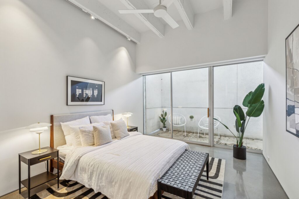A second bedroom that opens up to the expansive private terrace. 