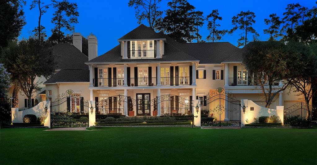 79 Windward Cove is an elegant, Italian-inspired estate with spectacular views of Lake Woodlands.  