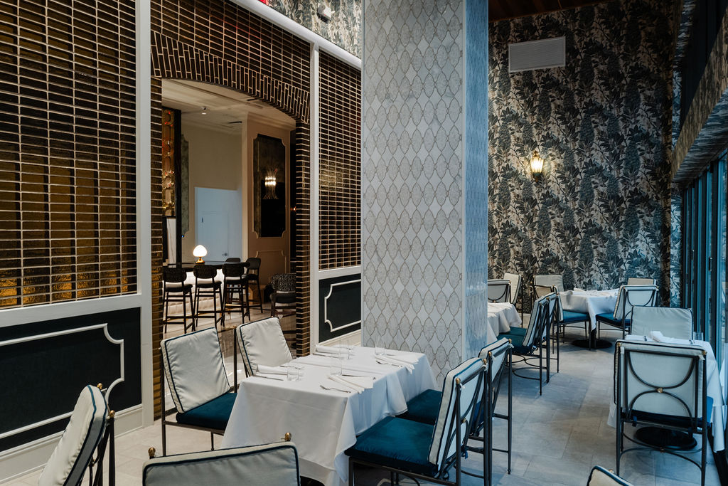 Let the outdoors inside at Turner's Cut. The glass bifold doors of the patio dining room adorned with a leaf adorned wallpaper can be opened on a beautiful day. (Photo by Brian Kennedy)