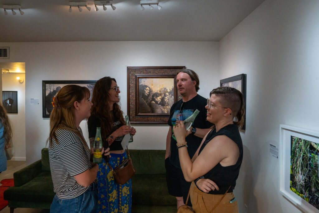 Photo lovers mingle while chatting about photography at FLATS' "Interwoven."  (Photo by Alan Nguyen)