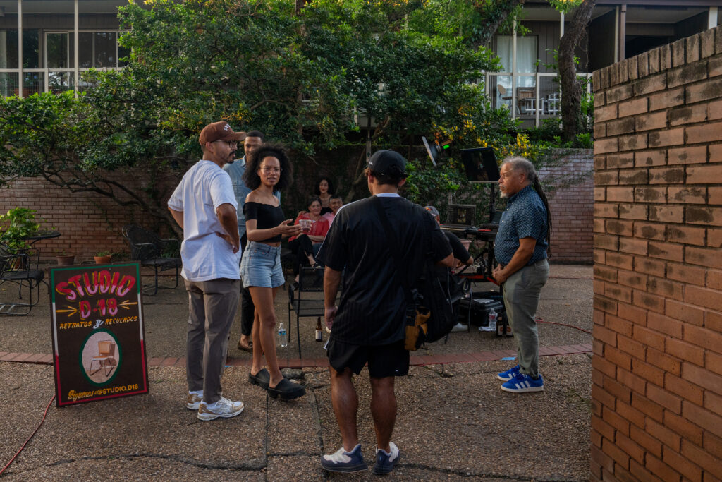 Studio D-18 takes portraits of attendees in the courtyard of Harwood Court at FLATS' "Interwoven."(Photo by Alan Nguyen)