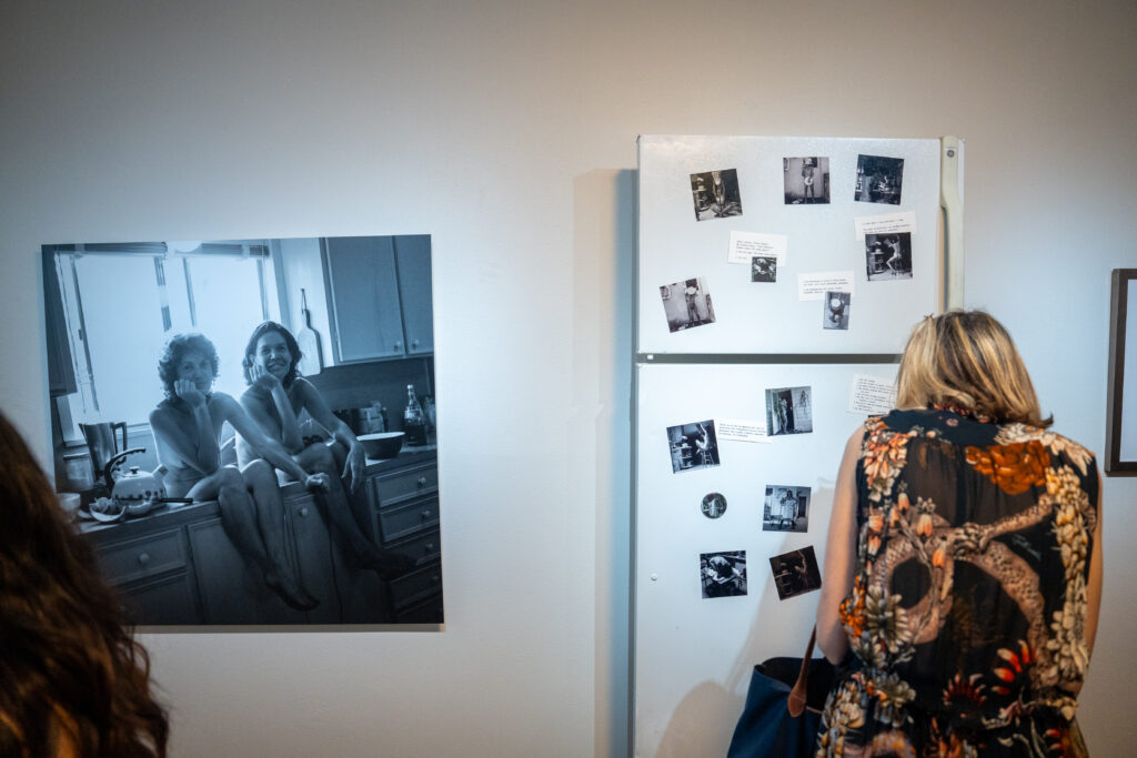 Viewers examine Mary Margaret Hansen's collection at FLATS' "Interwoven." (Photo by Alan Nguyen)