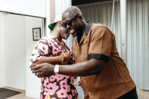 Kevin Barnett, Fred Agho embrace at the CoolxDad Real-Time Brunch. (Photo by William Issac)