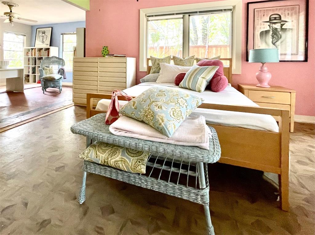 A spacious bedroom suite features a seating area.  (Photo by Douglas Newby & Associates)