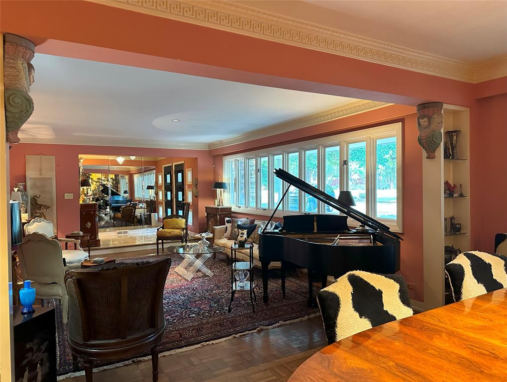Ornate crown moldings and plasterwork feature throughout the home.  (Photo by Douglas Newby & Associates)