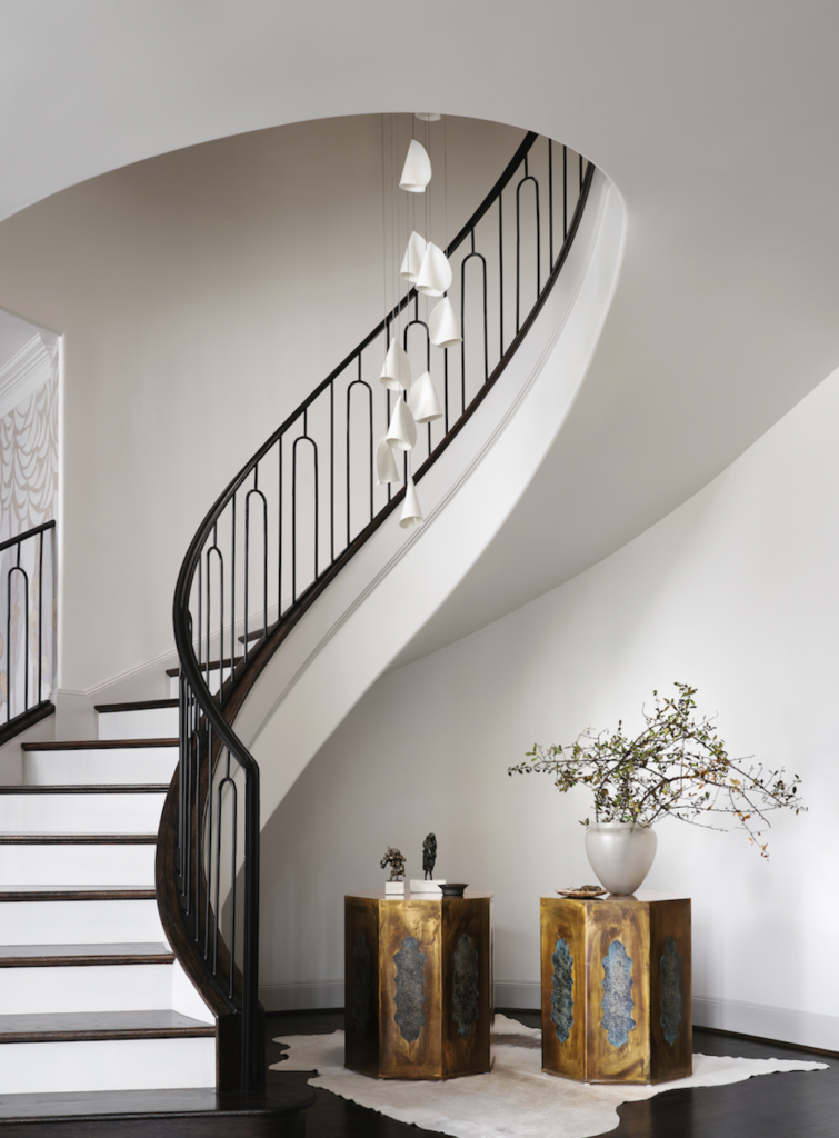 Jean Liu redesigned the stair railing and balusters based on a staircase she saw in France. Bocci chandelier from Scott + Cooner.  (Photo by Lisa Petrole)