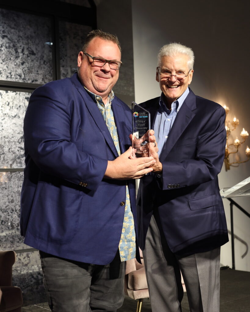 Honoree Chef Chris Shepherd with retired Houston Rockets play-by-play announcer Bill Worrell Jr. serving as emcee at the Family Houston luncheon.