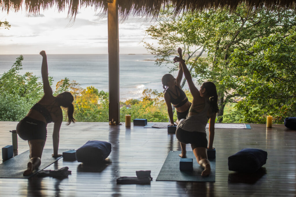 The yoga pavilion at Rancho Santana overlooking the ocean offers daily classes for wellness seekers, including special classes for surfers.