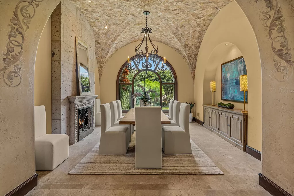 Vaulted cathedral ceilings overhead in the dining room at 2254 King Fisher Drive.