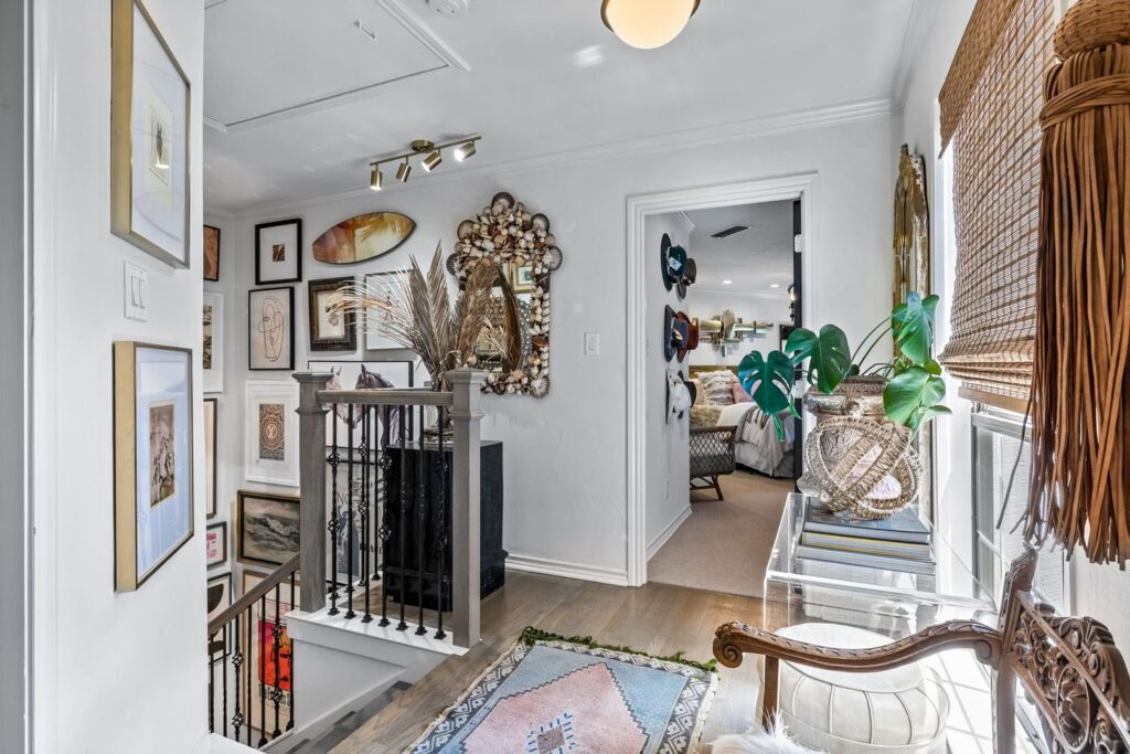 Cobb's layered decor at the top of the second-floor stairwell. 