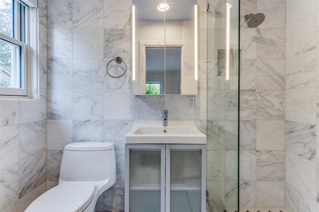One of three full bathrooms in the Kessler Park home.  (Photo by Micalizzi Real Estate)
