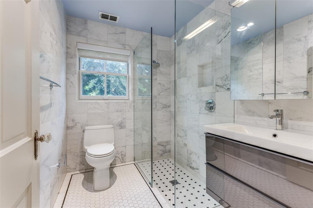 One of three full bathrooms in the Kessler Park home.  (Photo by Micalizzi Real Estate)