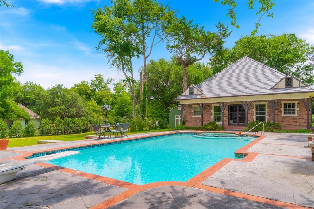 The spacious guest house sets afront the stately pool.