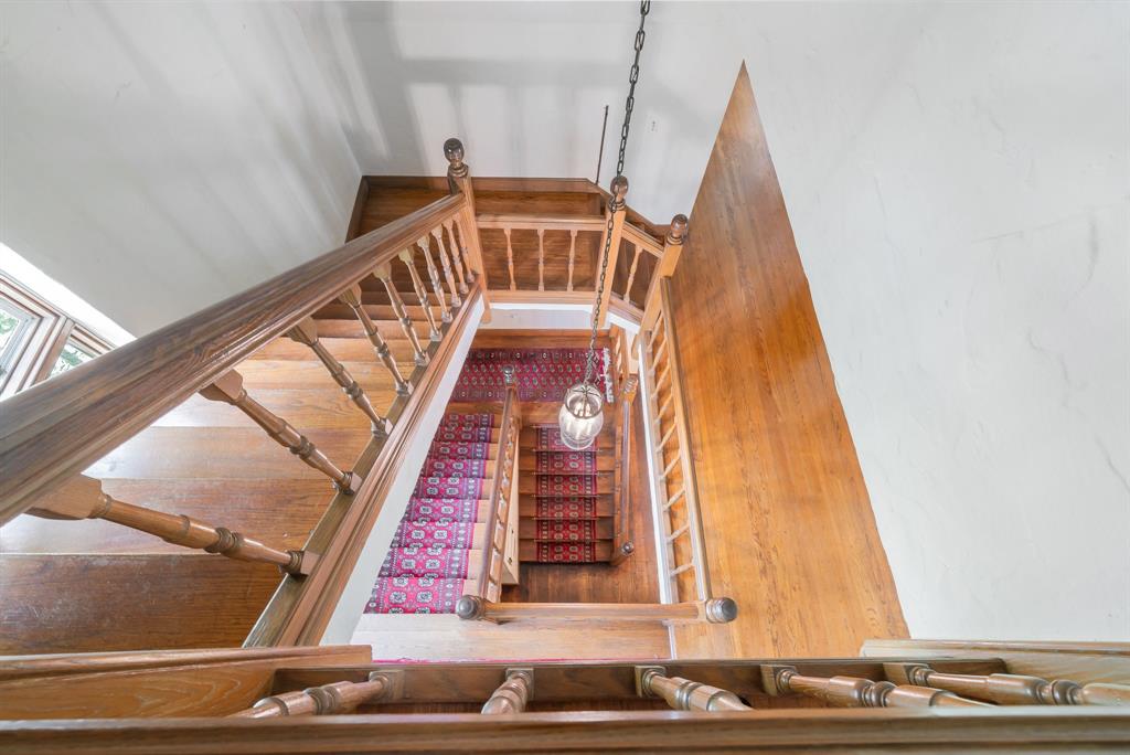 The three-story home features an eye-catching carpeted stairwell.
