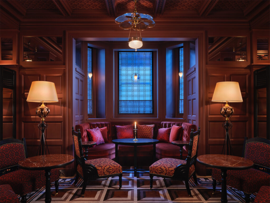 At Sloane's a sexy and dimly lit speakeasy features a carpet woven by Louis de Poortere.