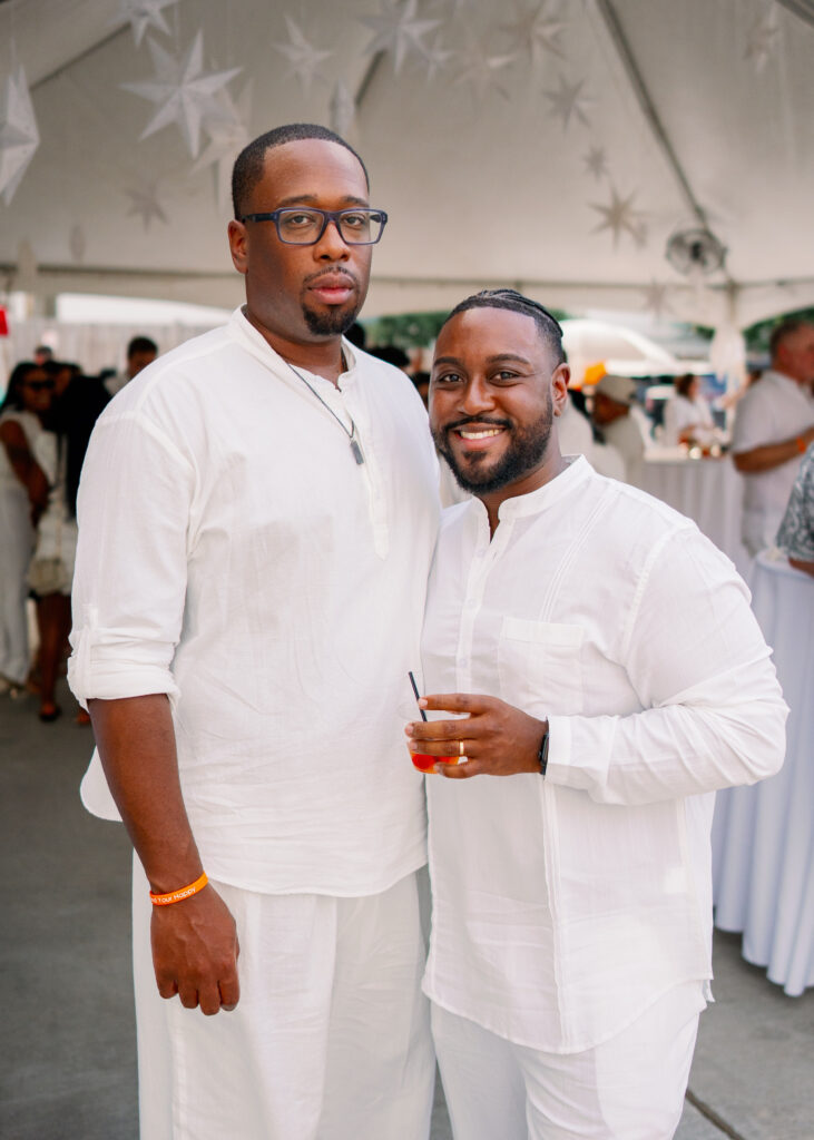 Guest, Devoun Rushing  at Nan & Company Properties' White Linen Night in The Heights soirée.