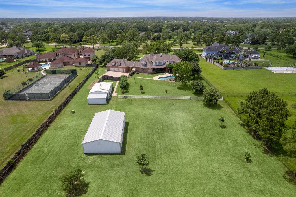 A spread of almost four acres at 2403 San Miguel in Friendswood is large enough for a double stall horse barn and room for riding. (Photo by TK Images for Compass)
