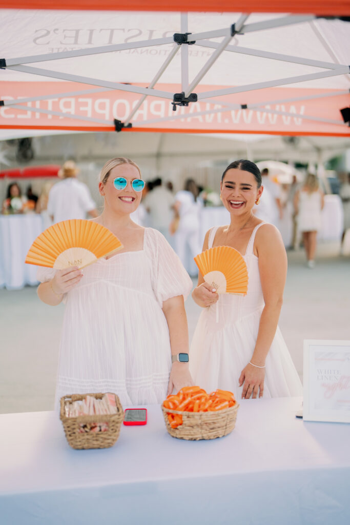 Blair Lamont, Chloé Detchessahar at Nan & Company Properties' White Linen Night in The Heights soirée.