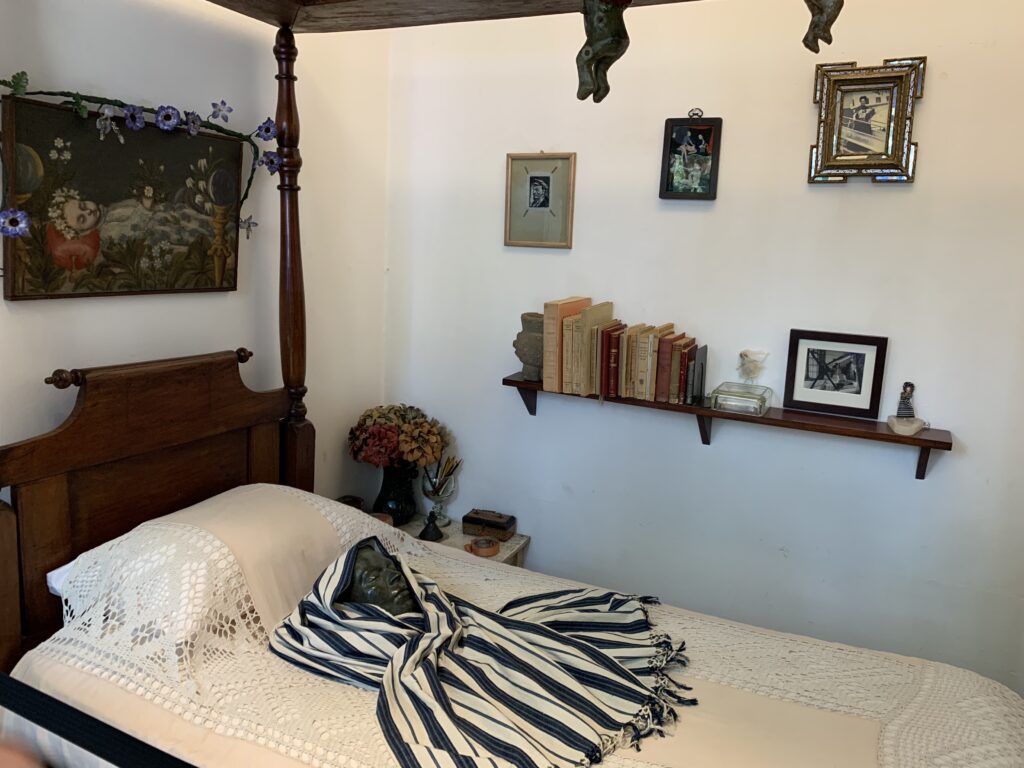 Frida Kahlo's bedroom, with her death mask atop bed