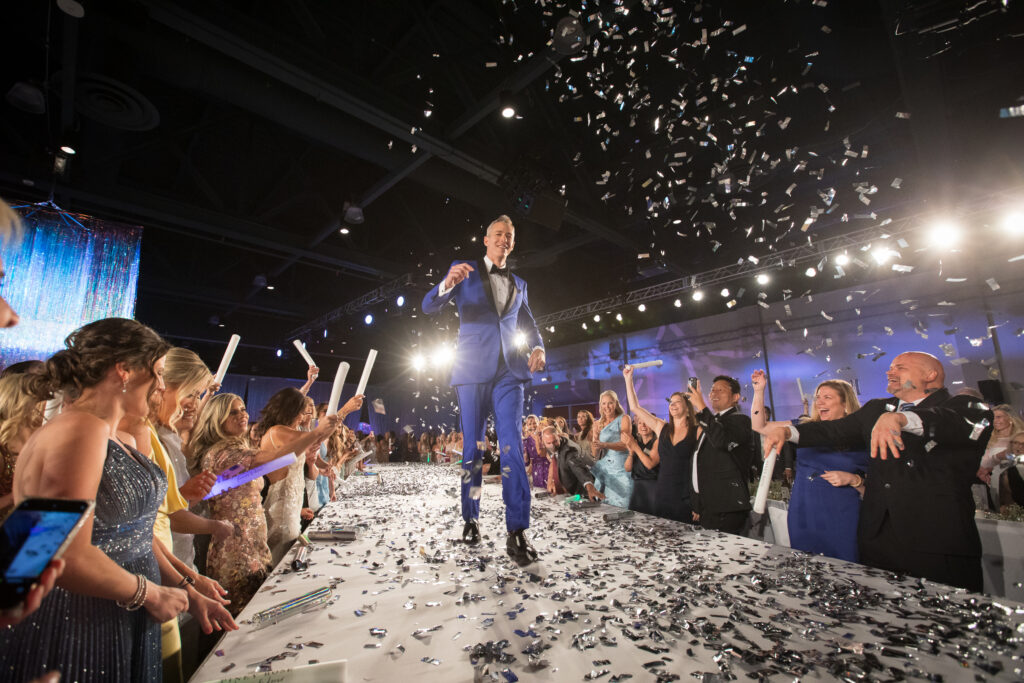 Jim Carman of Howard Hughes walked the runway in 2024 as a Community Champion at Interfaith’s The Walk gala. (Photo by Daniela Weaver)