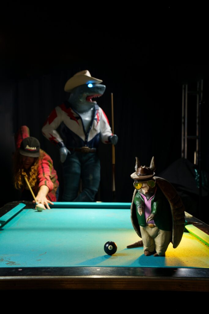 Cole Wilson playing pool in Cowboix Hevvven  (Courtesy Meow Wolf. Photo by Kate Russell)