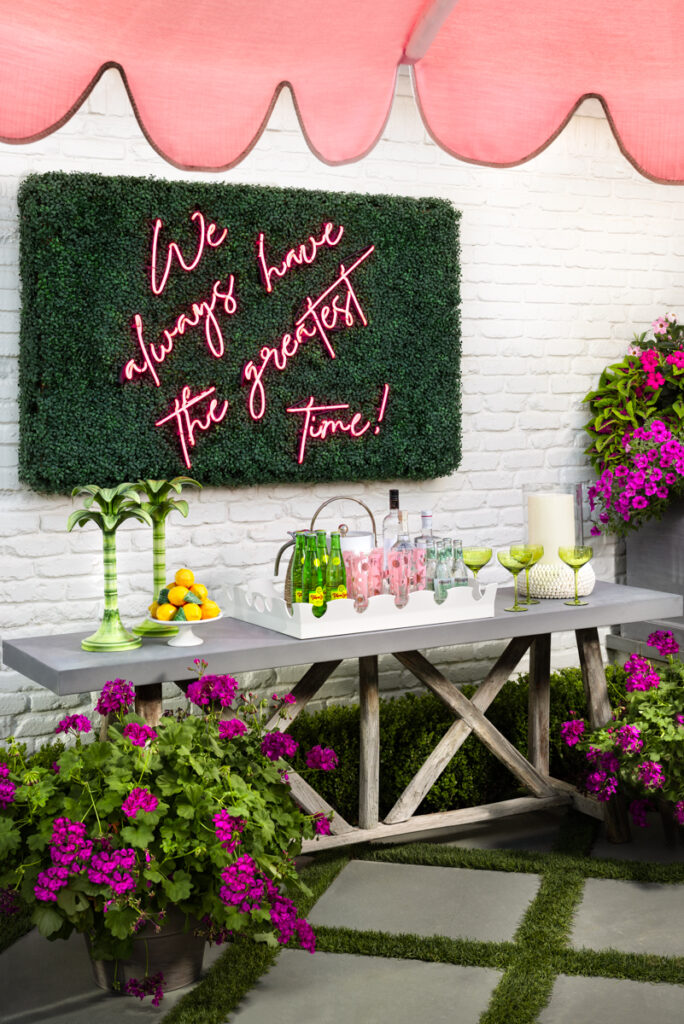 A custom neon sign (by designer Dan Houchard) sets the tone for gatherings. (Photo by Jennifer Baker)