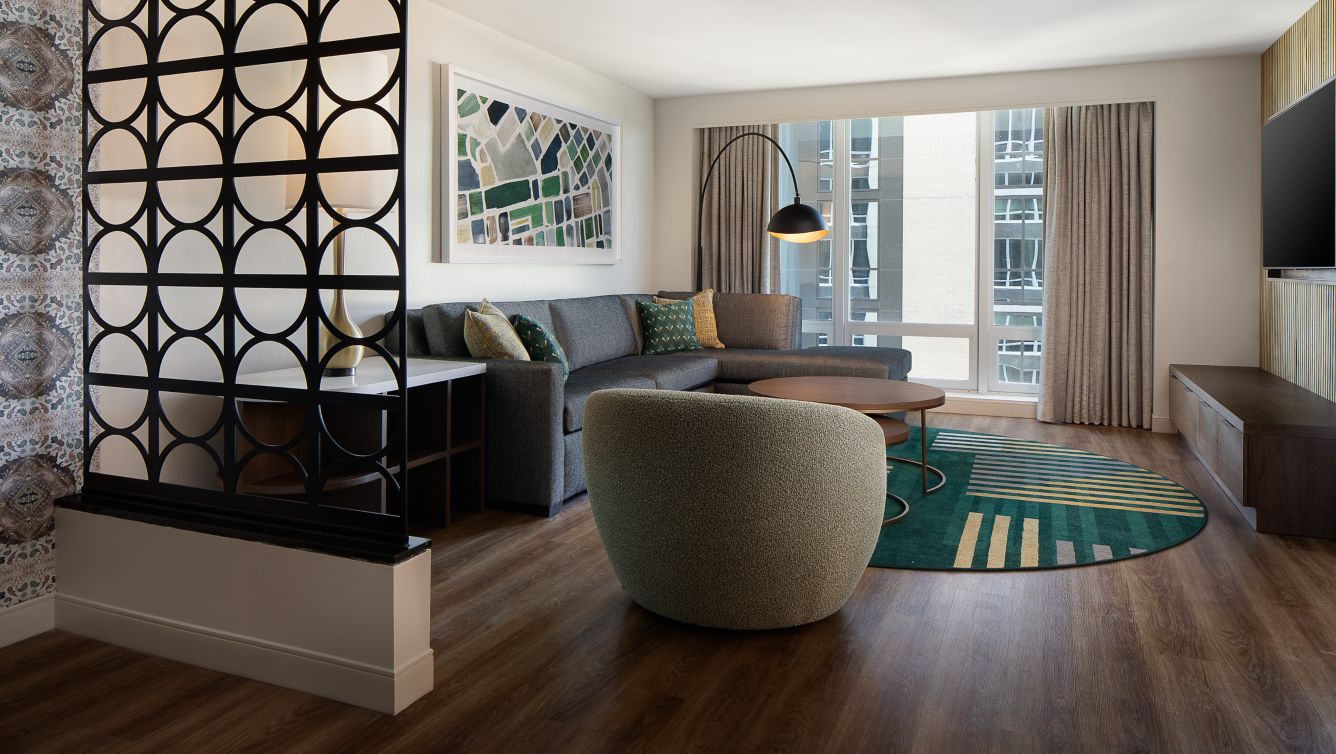 Living room with peek-a-boo screen and courtyard view.