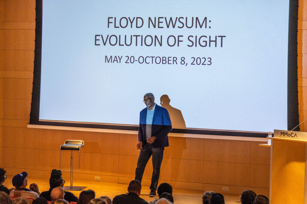Floyd Newsum addresses the crowd at Madison Museum of Contemporary Art in Madison, Wisconsin during the opening of his 2023 solo retrospective, "Evolution of Sight." (Courtesy Shalicia Johnson/Arrowstar Photography and Madison Museum of Contemporary Art)