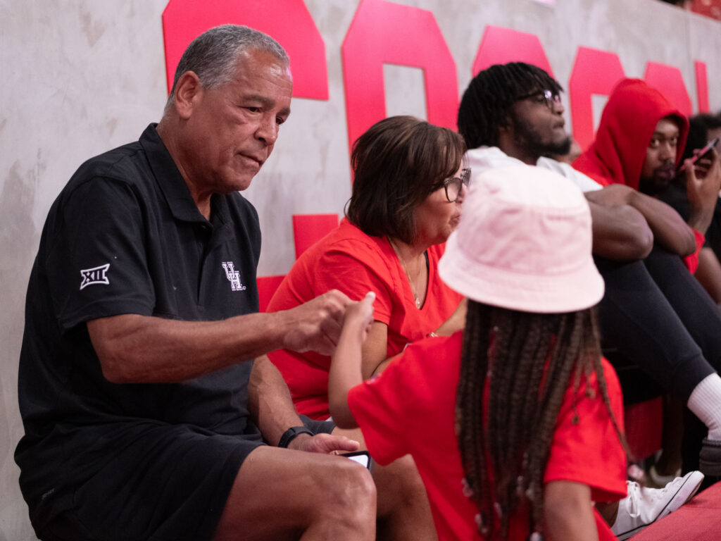 University of Houston basketball coach Kelvin Sampson is always ready to connect with a young fan. (Photo by F. Carter Smith)