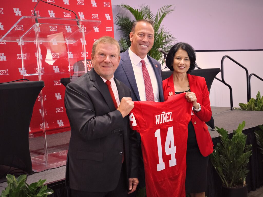 Tilman Fertitta, new University of Houston athletic director Eddie Nunez and Renu Khator have a UH moment. (Photo by F. Carter Smith)