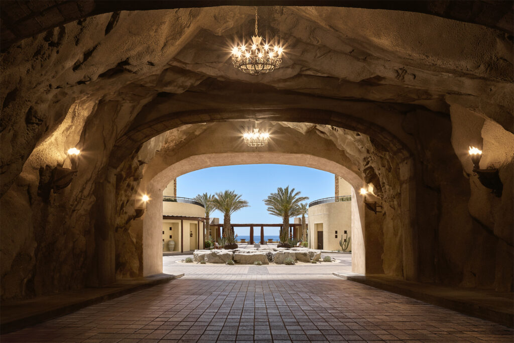 Enter through the hotel's private tunnel — an impressive, man-made feat lined with gas-fired lanterns — and emerge into the serenity of Waldorf World