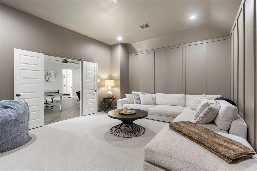 The media room is a calm space situated just off the game room, perfect for catching up on movies or sports games. 